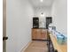 Kitchenette features wine storage, wood cabinets, dark countertops, and ample room for coffee and drink preparation at 4840 Moon Rd, Powder Springs, GA 30127