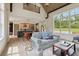 Open concept living room featuring a full view of the kitchen, dining area, and backyard at 4840 Moon Rd, Powder Springs, GA 30127