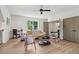Bright living area with hardwood floors, modern furnishings, and a ceiling fan at 4840 Moon Rd, Powder Springs, GA 30127