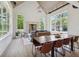 Open-concept living and dining area with abundant natural light, a fireplace, and views of the surrounding greenery at 4840 Moon Rd, Powder Springs, GA 30127