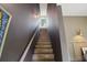 Stairway leading to upper level with natural light and modern design at 4840 Moon Rd, Powder Springs, GA 30127