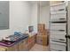 Organized storage room featuring shelves filled with boxes, an iMac and other household items neatly arranged at 4840 Moon Rd, Powder Springs, GA 30127