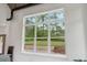 Large window offering scenic views of the yard, garden, and surrounding greenery from inside the home at 4840 Moon Rd, Powder Springs, GA 30127