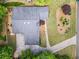 Aerial view of the home, roof, deck, driveway and lawn showcasing the property's layout and landscaping at 5148 Stratham Dr, Dunwoody, GA 30338