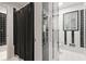 Classic bathroom with black and white tile and shower with black shower curtain at 5148 Stratham Dr, Dunwoody, GA 30338
