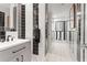 Modern bathroom showcases stylish black and white tiles and a sleek vanity at 5148 Stratham Dr, Dunwoody, GA 30338