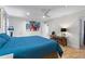 Bright bedroom featuring a ceiling fan, recessed lights, and abstract artwork above the bed at 5148 Stratham Dr, Dunwoody, GA 30338
