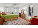 The bedroom features a work area, decorative rug, and access to a stylish, modern bathroom at 5148 Stratham Dr, Dunwoody, GA 30338