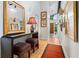 Inviting entryway with elegant decor, a mirror, accent table and warm lighting at 5148 Stratham Dr, Dunwoody, GA 30338