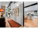 Open-concept hallway and entry featuring unique artistic decor and hardwood floors at 5148 Stratham Dr, Dunwoody, GA 30338