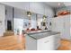Open-concept kitchen featuring an island, stainless steel appliances and adjacent dining area at 5148 Stratham Dr, Dunwoody, GA 30338