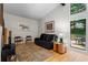 Inviting living room with views of the outdoor patio and deck, featuring cozy seating at 5148 Stratham Dr, Dunwoody, GA 30338