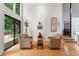 Living room featuring floor-to-ceiling windows offering natural light and sliding door to back deck at 5148 Stratham Dr, Dunwoody, GA 30338