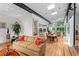 Spacious living area with hardwood floors, open layout to kitchen, and ample natural light from large windows at 5148 Stratham Dr, Dunwoody, GA 30338