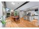 Open floorplan showing a dining room leading to the kitchen and living room, filled with natural light at 5148 Stratham Dr, Dunwoody, GA 30338
