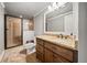 Bathroom featuring tiled shower, granite countertop, and dark wood vanity at 121 Harmony Oaks Trl, Canton, GA 30115
