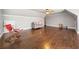 Spacious bonus room with comfortable seating, hardwood floors and dormer windows at 121 Harmony Oaks Trl, Canton, GA 30115