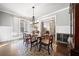 Elegant dining room featuring natural light, chair rails, and modern chandelier at 121 Harmony Oaks Trl, Canton, GA 30115