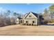 Charming home exterior features a landscaped yard and a well-manicured lawn at 121 Harmony Oaks Trl, Canton, GA 30115