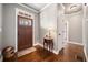 Inviting foyer featuring a wooden front door, hardwood floors, and neutral wall colors at 121 Harmony Oaks Trl, Canton, GA 30115