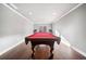 Spacious game room with hardwood floors, neutral walls, and a well-maintained billiards table at 121 Harmony Oaks Trl, Canton, GA 30115