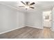 Bedroom featuring hardwood floors, ceiling fan, and bright natural light at 2002 Country Park Se Dr, Smyrna, GA 30080