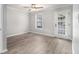 Bedroom featuring hardwood floors, ceiling fan, and bright natural light at 2002 Country Park Se Dr, Smyrna, GA 30080