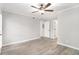 Bright bedroom with hardwood floors, ceiling fan, and neutral paint at 2002 Country Park Se Dr, Smyrna, GA 30080