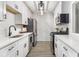 Modern kitchen featuring white cabinets, stainless steel appliances, and quartz countertops at 2002 Country Park Se Dr, Smyrna, GA 30080