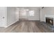 Large living room with hardwood floors, fireplace, and an open transition to the kitchen at 2002 Country Park Se Dr, Smyrna, GA 30080