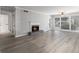 Bright living room with a decorative fireplace, hardwood floors, and plenty of space at 2002 Country Park Se Dr, Smyrna, GA 30080