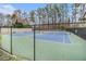 Tennis Court with a chain link fence in a common recreational area at 2002 Country Park Se Dr, Smyrna, GA 30080