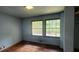 A bedroom featuring wood floors and two windows at 2886 The Fontainebleau Sw, Atlanta, GA 30331