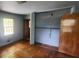 A bedroom featuring wood floors, two windows, and a closet at 2886 The Fontainebleau Sw, Atlanta, GA 30331