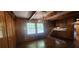 The dining area features wood paneling, a hanging chandelier, and views into the kitchen, creating a warm, inviting atmosphere at 2886 The Fontainebleau Sw, Atlanta, GA 30331