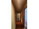A hallway featuring wood floors and doorways to adjacent rooms at 2886 The Fontainebleau Sw, Atlanta, GA 30331