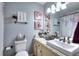 Charming bathroom featuring floral shower curtain, granite countertop and decorative wall art at 3716 Meeting St, Duluth, GA 30096