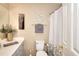 Cozy bathroom with decorative accents, shower and tub, vanity, toilet, and linen closet at 3716 Meeting St, Duluth, GA 30096