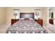 Cozy bedroom with a large bed, side tables, and windows providing natural light at 3716 Meeting St, Duluth, GA 30096