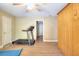 Bedroom with a Murphy bed, treadmill, ceiling fan, and wood-look flooring at 3716 Meeting St, Duluth, GA 30096