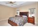 Cozy bedroom with a large bed, side tables, and windows providing natural light at 3716 Meeting St, Duluth, GA 30096