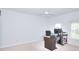 Bright bedroom with white walls, carpet, a fan, and two windows at 3716 Meeting St, Duluth, GA 30096