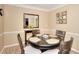 Cozy dining room with hardwood floors, round table, neutral paint color, and stylish decor at 3716 Meeting St, Duluth, GA 30096