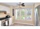 Eat-in kitchen is bright with large windows and stainless steel appliances at 3716 Meeting St, Duluth, GA 30096