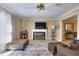 Comfortable living room with fireplace and ample natural light provides a relaxing atmosphere at 3716 Meeting St, Duluth, GA 30096