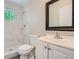 Bathroom featuring new vanity, toilet, fixtures and tiled shower and floor at 1002 Ira Sw St, Atlanta, GA 30310