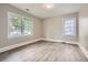 Sunlit bedroom featuring hardwood floors, fresh neutral paint and two large windows at 1002 Ira Sw St, Atlanta, GA 30310