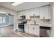 Modern kitchen featuring white cabinets, stainless steel appliances, and an open floor plan at 1002 Ira Sw St, Atlanta, GA 30310