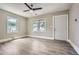Bright living room featuring hardwood floors, fresh neutral paint and entry door at 1002 Ira Sw St, Atlanta, GA 30310