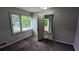 View of a bedroom featuring a window providing natural light, carpeted floors, and gray walls at 1091 Luther Sw Dr, Mableton, GA 30126